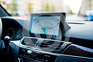 Gps device mounted to the dashboard of car with map on it. Generative AI