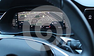 The GPS map is displayed on the dashboard in front of the driver\'s eyes inside the car