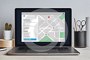 GPS map navigation app on laptop screen. Location tracker concept
