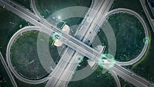 GPS navigation and autonomous driverless transportation concept. Aerial view of transport junction with cars and trucks photo