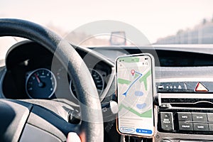 Gps navigation map system. Global positioning system on smartphone screen in auto car on travel road. GPS device