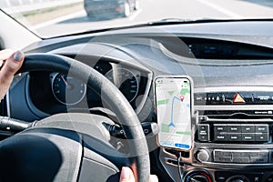 Gps navigation map system. Global positioning system on smartphone screen in auto car on travel road. GPS device