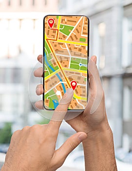 GPS Navigation System App Opened On Smartphone In Male Hands