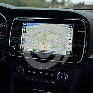Gps navigation system displaying map on dashboard of modern car