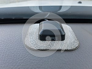 gps tracker antenna on car dashboard