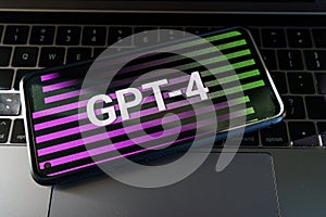 GPT - 4 on screens. OpenAI released new version of GPT 4. ChatGPT AI chatbot