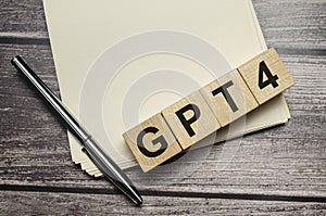 gpt4 word on wooden block and pen with papers on wooden background photo