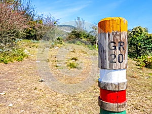 GR20 trail sign in the Araiz valley with the Aralar mountains from the Betelu area, Navarre. Spain photo