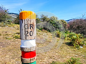 GR20 trail sign in the Araiz valley with the Aralar mountains from the Betelu area, Navarre. Spain