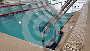 Grab bars chrome ladder railings in swimming pool
