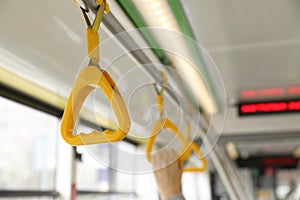 Grab pole with handgrip handles in public transport photo
