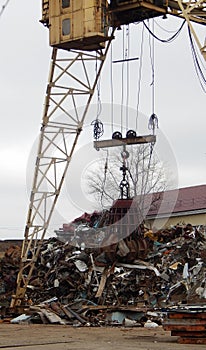 Gantry Crane Grabber Loading Scrap Metal At Junkyard