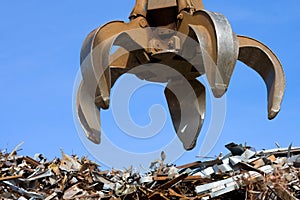 Grabber up on the metal heap