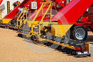 Grabbing grain from asphalt surface by scrapers of conveyor grain loader