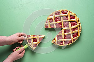 Grabbing slice of cake. Raspberry pie with lattice top