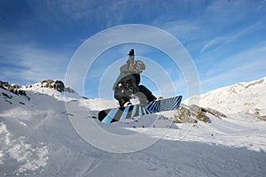 Grabbing Snowboarder