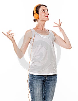 Graceful 30s woman smiling in listening to happy music