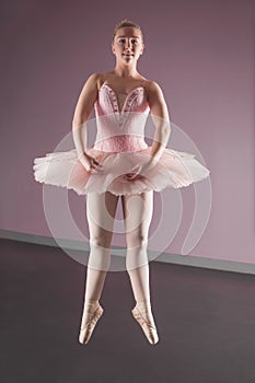 Graceful ballerina dancing en pointe