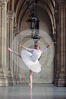 Graceful ballerina dancing in a palace