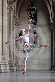 Graceful ballerina dancing in a palace