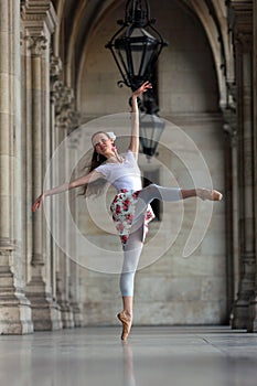 Graceful ballerina dancing in a palace