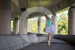 Graceful ballerina doing dance exercises on a