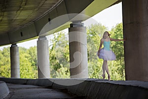 Graceful ballerina doing dance exercises on a