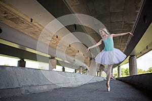 Graceful ballerina doing dance exercises on a