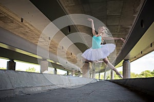 Graceful ballerina doing dance exercises on a