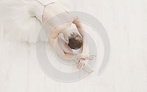 Graceful Ballerina stretching, ballet background, top view