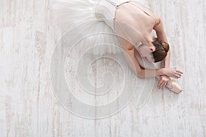 Graceful Ballerina stretching, ballet background, top view