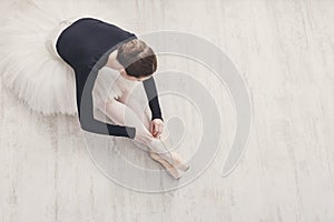 Graceful Ballerina stretching, ballet background, top view