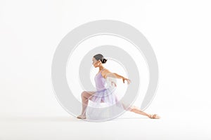 Graceful Ballet Dancer Posing Against White Background