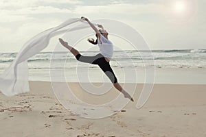 Graceful dancer on beach photo