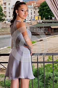 Graceful Elegance: Young Woman Posing in Restaurant Garden