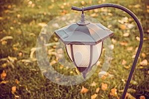 Graceful garden lantern with photocell