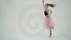 Graceful Girl Gymnast Performing Rhythmic Gymnastics Exercise.