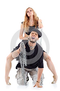 Graceful girl sits on papper back and tames his chain
