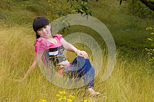 A graceful girl with weeds