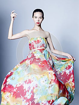 Graceful woman in color dress