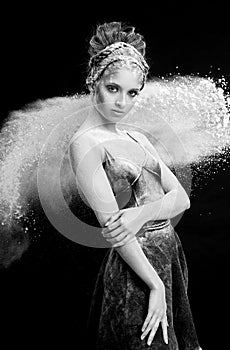 Graceful woman dancing in cloud of dust