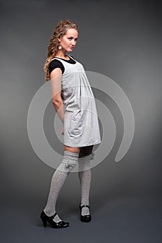 Graceful woman in grey dress
