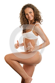 Graceful woman with thumbs up