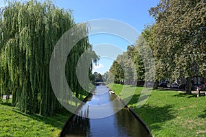 Gracht or canal in Friedrichstadt, the beautiful town and travel destination in northern Germany founded by Dutch settlers, copy photo