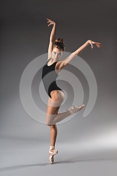 Gracile woman posing in gymnastic swimsuit