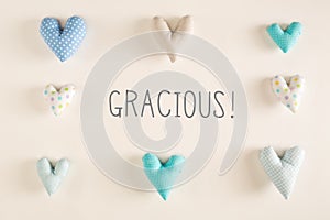 Gracious - Thank you in Spanish language with blue heart cushions