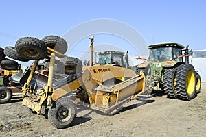 Grader scheduler. A retractor with a grader trailer.