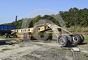 Grader on a trailer for heavy equipment.