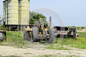 Grader on a trailer for heavy equipment.