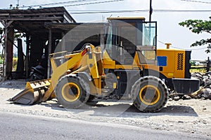 Grader and yellow bulldozer excavator Construction Equipment with clipping on street.